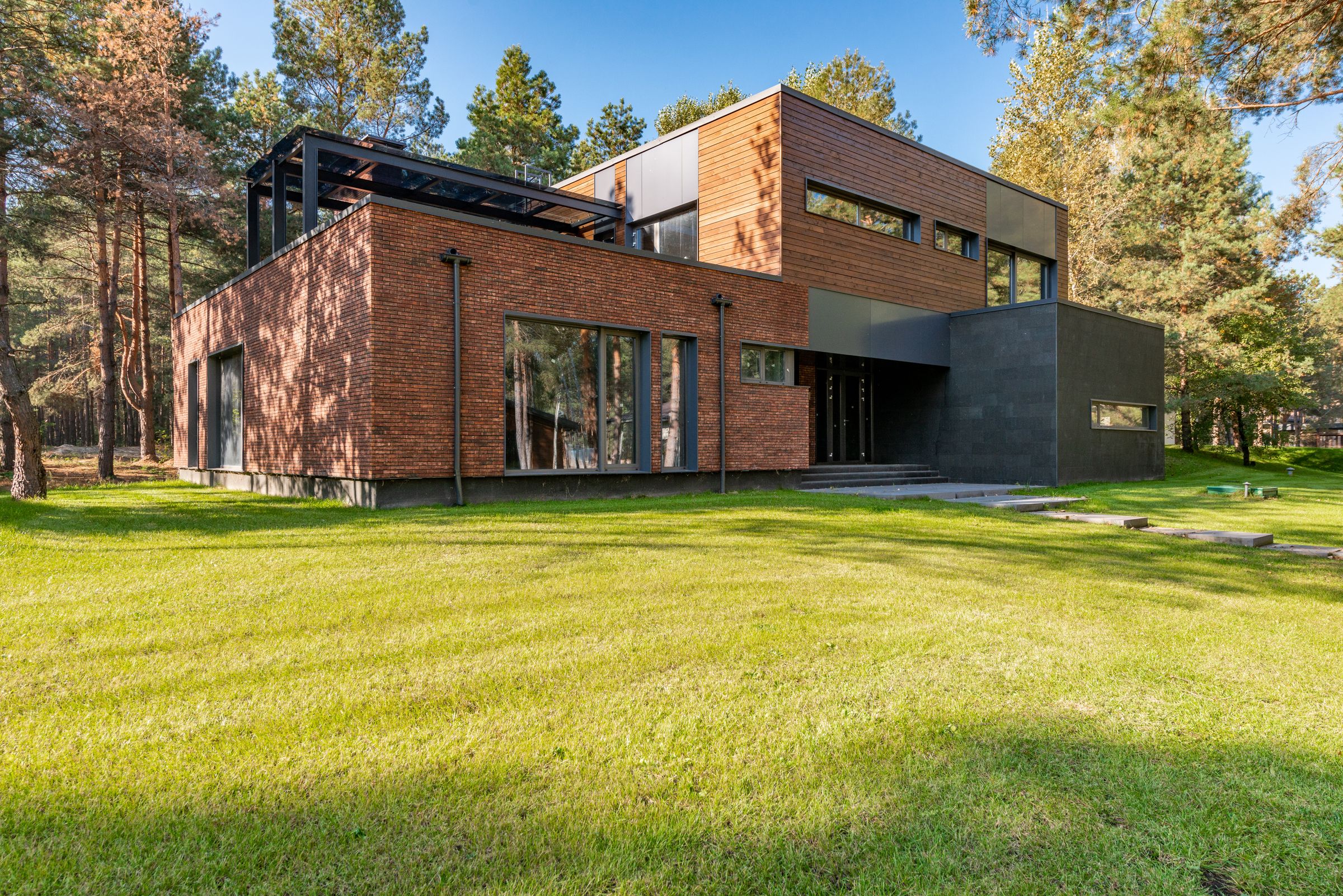 Architectural inspiration: contemporary brick and timber home opening onto a garden